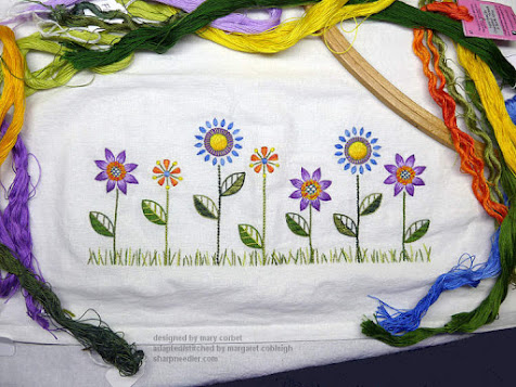 Embroidery complete on flour sack towel with flowers