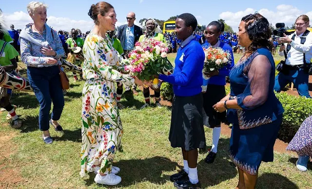 Crown Princess Victoria wore an Irmaline floral print maxi dress, floral top and skirt by Rodebjer. The Gundua Foundation