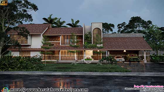 Wide Green House Design evening front view