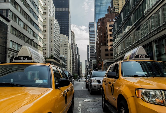 Two lines of yellow taxis