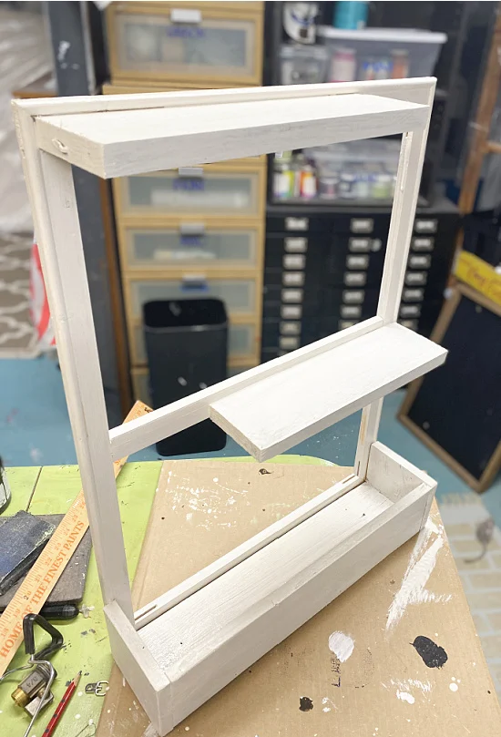 white shelves and planter box