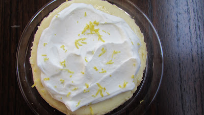 homemade lemon and orange flavors (and zest) in mini citrus cheesecakes, topped with homemade whipped cream and lemon zest