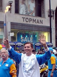 Roger Black runs through Oxford Circus