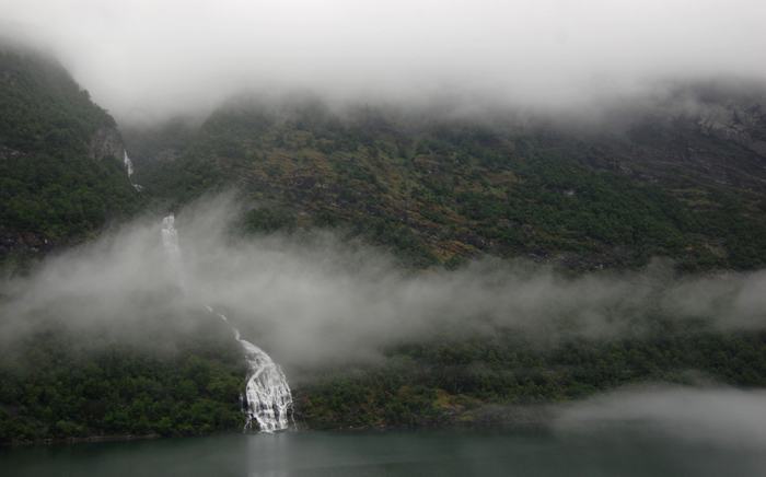 The Geirangerfjorden is a fjord in the Sunnmøre region of Møre og Romsdal county, Norway. It located entirely in Stranda Municipality. It is a 15-kilometre (9.3 mi) long branch off of the Sunnylvsfjorden, which is a branch off of the Storfjorden (Great Fjord). The small village of Geiranger is located at the end of the fjord where the Geirangelva river empties into it.