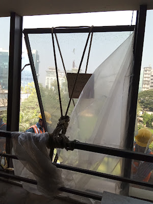 Facade Maintenance-Window Tied with Ropes