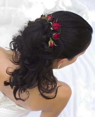 Roses is often simply integrated into the bridal hairstyles as they're