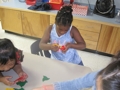 girl playing with math manipulatives