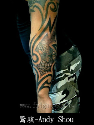 This free tattoo design is a combination of tribal totem and a scary skull .