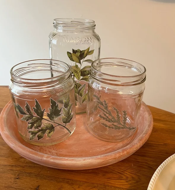 Photo of food jars with botanical decor transfers.