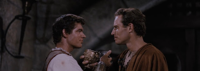 Messala (Stephen Boyd) and Judah Ben-Hur (Charlton Heston) share one of their last friendly moments.