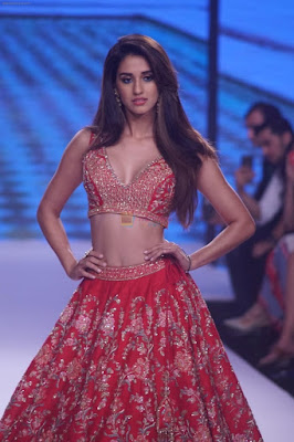 Disha Patani wearing red ghagra choli ethnic wear rampwalking revealing her beautiful breasts