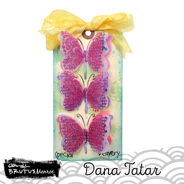 Special delivery mixed media layered butterfly tag using watercolor paper, fiber sheets, vellum, Puncheto, and acetate along with glittered mediums.