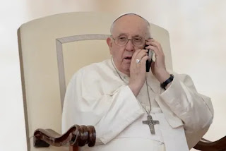 Pope Francis talking on a mobile phone