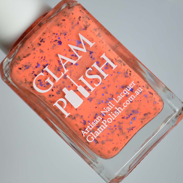 orange nail polish with multichrome flakies in a bottle