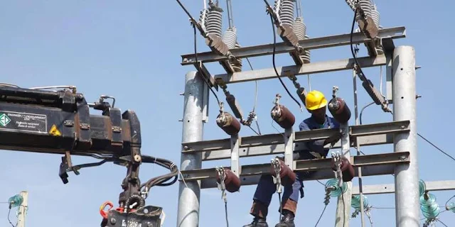 KPLC workers on a transmission line. PHOTO | NMG