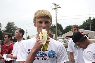 Runner Landon Vowels eats a post-race snack