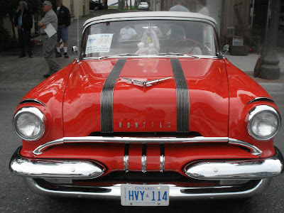 and such fabulous colors like this tomato red and black 50's car