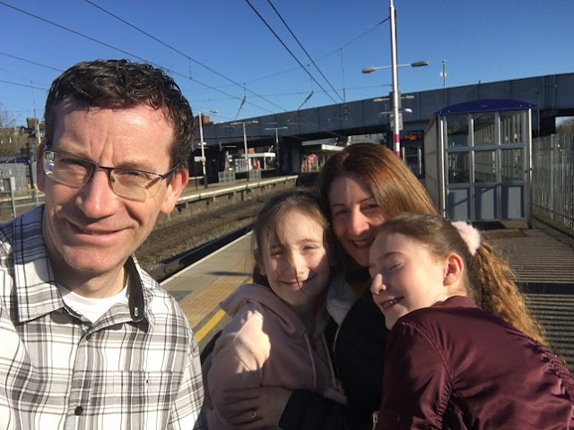 family group photo at train station