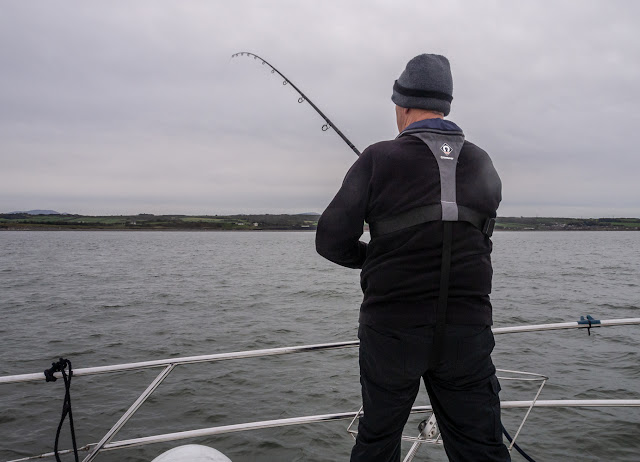 Photo of Phil fishing on Ravensdale's foredeck