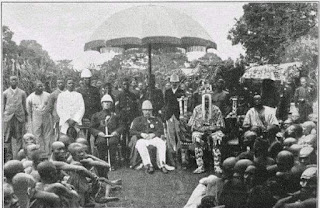 British Authorities sitting with A Monarch and Nigerians during the colonial Era Image credit: Getty Image