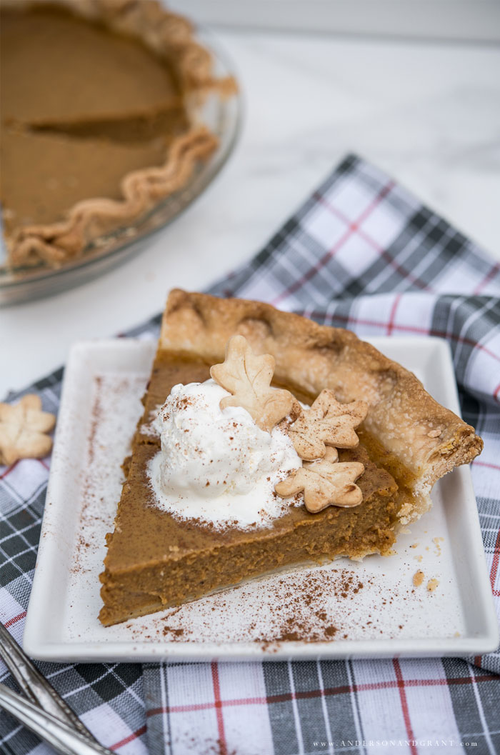 Piece of pumpkin pie with whipped cream