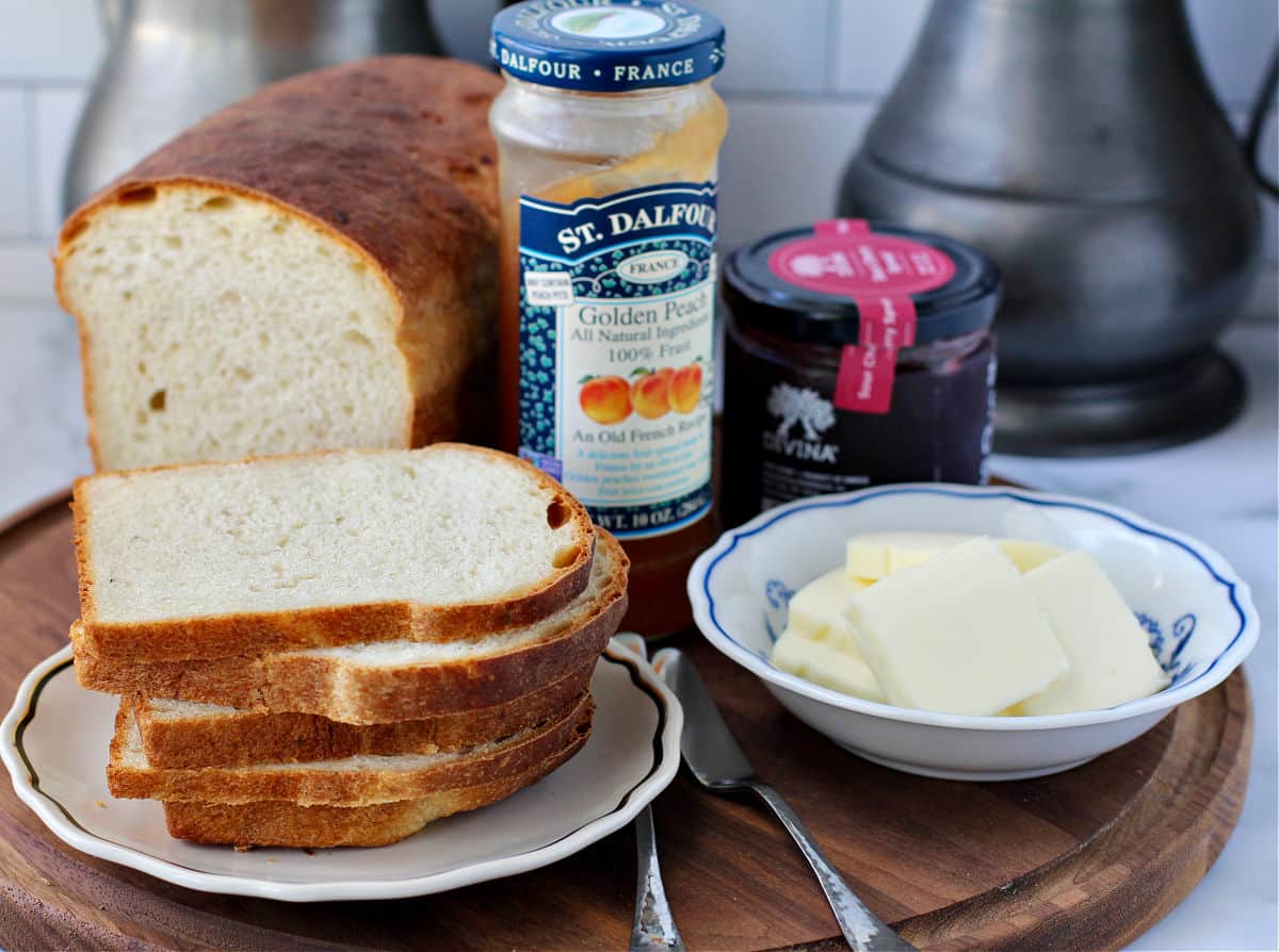 Yeasted Banana Sandwich Bread breakfast setting with jam and butter.