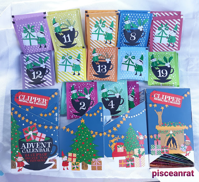 Clipper Advent Calendar 24 Cups of Organic Teas & Infusions in Happy Mondays, Berry Burst, Rise & Shine, Hibiscus & Raspberry, Orange & Lemon, Calmer Cameleon, Love Me Truly, Snore & Peace, Green Tea & Lemon, White Tea & Raspberry, Lemon & Ginger, and Nighty Night.