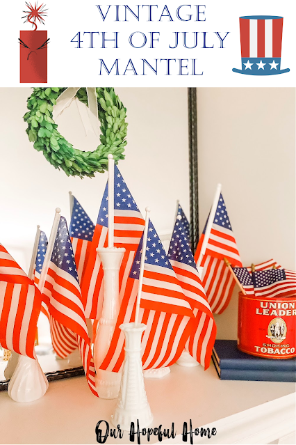 American flags in milk glass vases boxwood wreath mantel decor