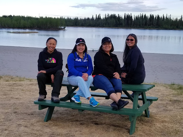 Friends bonding walk by the lake