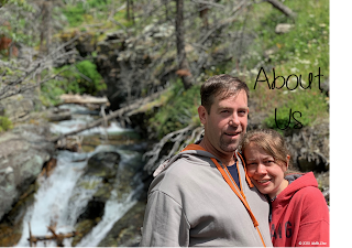 A picture of the husband and wife creators of Wolfe Stew with a waterfall in the background.