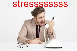 man-shouting-in-phone-due-to-stress