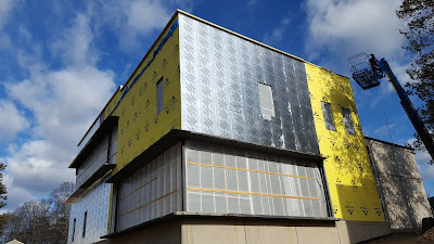 construction on the Library is making progress, additional insulation is being added to the exterior