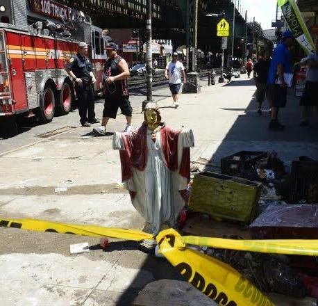 'Jesus' statue doesn't get burnt as firefighters retrieve debris from burning New York religious shop (photo)