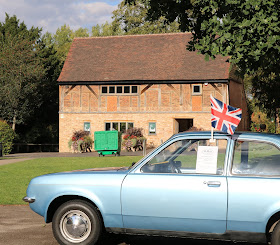 Old car with Union Jack with Eastcote House behind