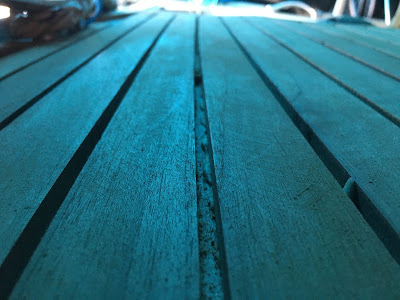 New teak deck being layed on yacht