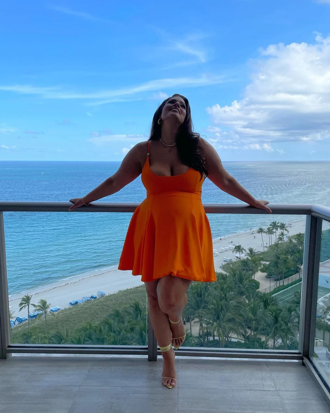 Ashley Graham Wore An Orange Versace Maternity Mini