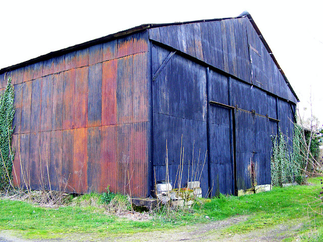 Corrugated iron shed.  Indre et Loire, France. Photographed by Susan Walter. Tour the Loire Valley with a classic car and a private guide.