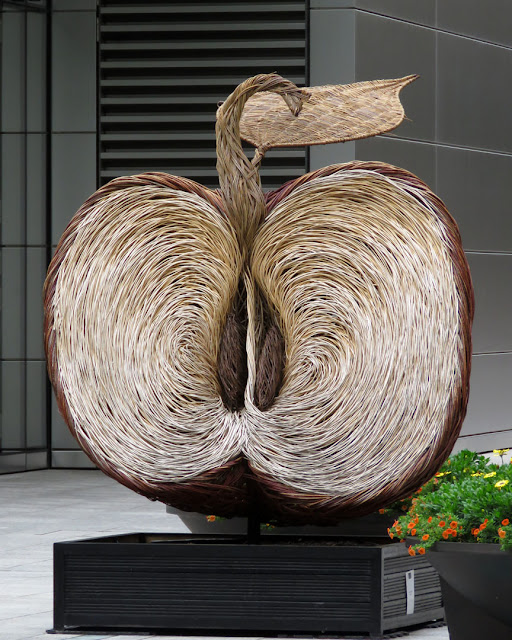 Broadgate Apple by Tom Hare, site-specific woven willow sculpture , Finsbury Avenue Square, Broadgate, London