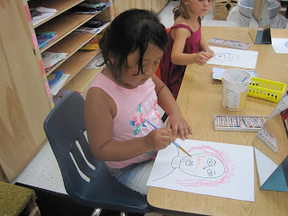 girl using a paint brush