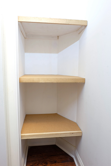 view of three shelves in closet