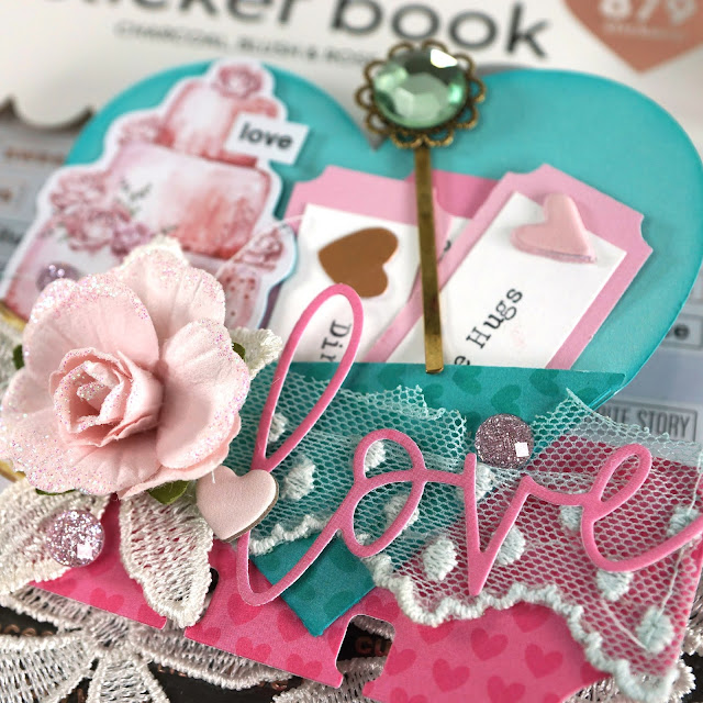 Heidi Swapp Memorydex Valentine's advent calendar made with the Prima With Love collection by Frank Garcia; die cut heart pocket card with cake ephemera, stickers, paper flowers, jewels and lace trim
