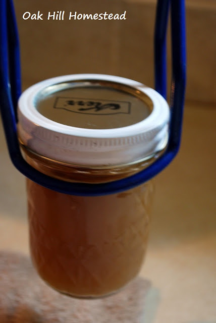 Use a jar lifter to put the jars in the canner.