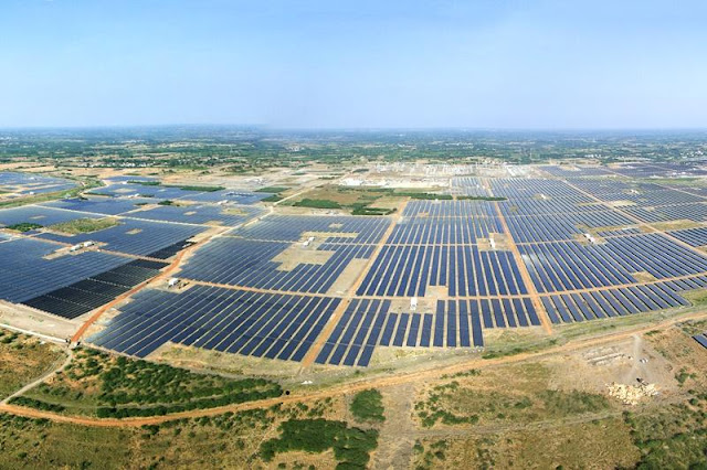 Image Attribute: The file photo of Adani's Kamuthi Solar Park in Tamil Nadu, Southern State of India. Dubbed as one of the largest solar photovoltaic plants in the world. / Source: Wikimedia Commons