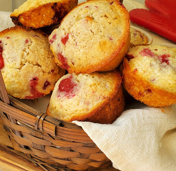 muffins in a basket with berries