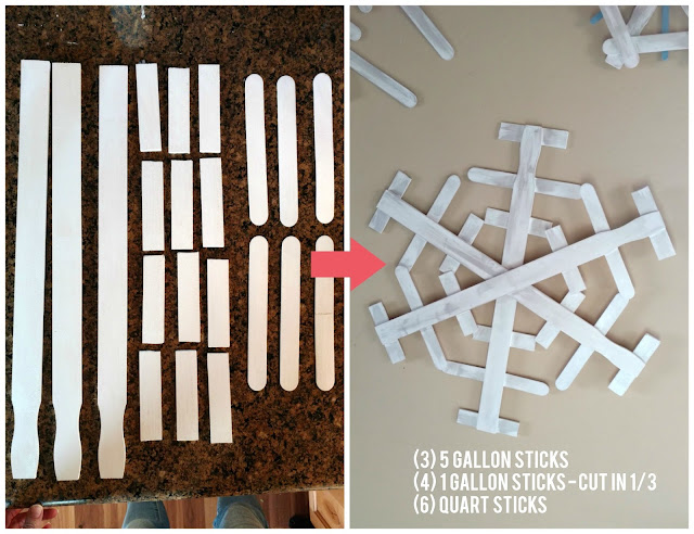 Use paint sticks from a hardware store and some paint to make these fun and rustic snowflakes for your home!  I made 3 of them for less than $4!