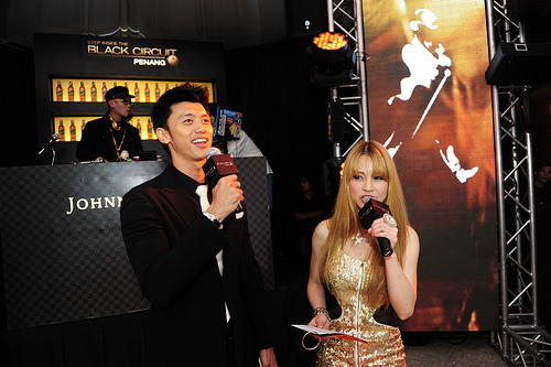 Dominic Lau host of E News Asia and Deborah Henry the current Miss 