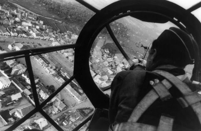 View of an undamaged Polish city from the cockpit of a German medium bomber aircraft, likely a Heinkel He 111 P, in 1939.