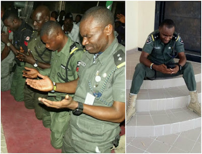 Police officers kneel to thank God for their safe return from the North after 3 months 