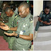 Police officers kneel to thank God for their safe return from the North after 3 months 