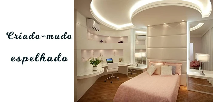 quarto moderno com criado-mudo espelhado e decoração rosa